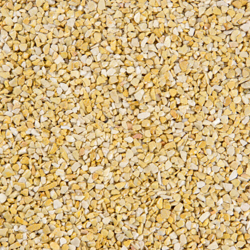 Nahaufnahme eines gelben Steinteppichs mit kleinen Steinen