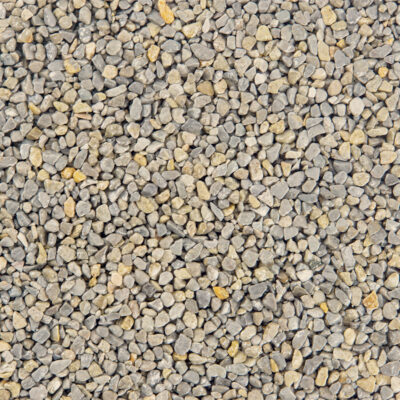 Nahaufnahme von kleinen, gemischten Steinen in Beige, Grau und Gelb