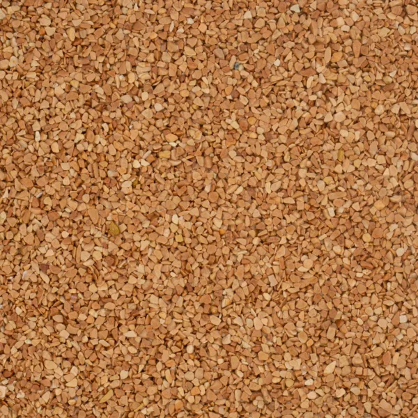 Nahaufnahme von gold-orange-rotem Marmorkies mit gleichmäßiger Körnung